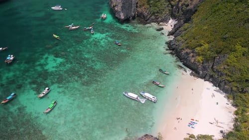 Aerial View of Tropical Bay with Boats Near White Sandy Beach and Turquoise Water