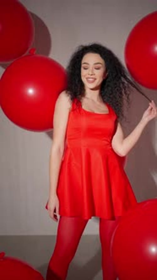 Woman in Red with Balloons Woman in Red Dress and Tights with Giant Red Balloons