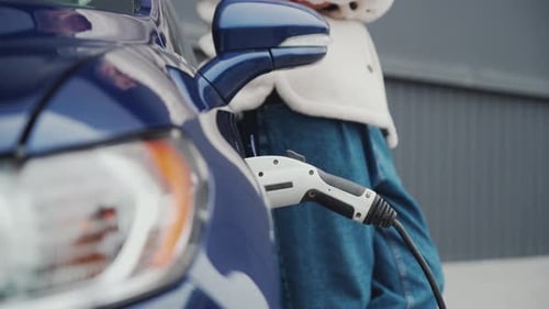 Electric Car Charging on Urban Street