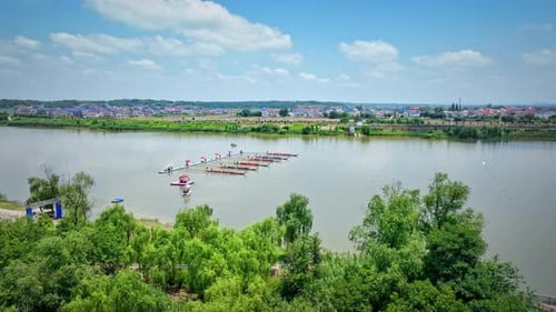 Dragon Boat team rowing to the pace of an onboard Drummer.