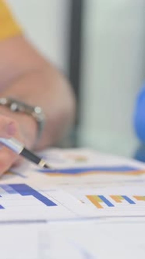 Close up of Creative People Working on Business Report, vertical video