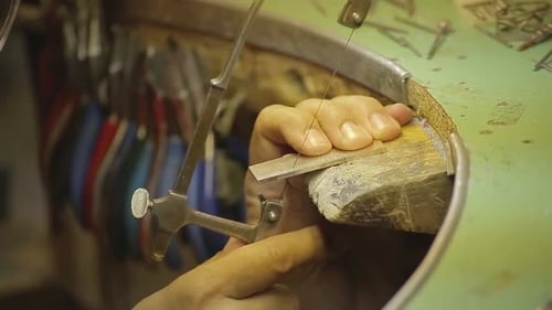 Italian Goldsmith at work building an engagement or a wedding ring.