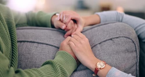 Home, closeup and couple holding hands, support and marriage with trust, relationship and romantic