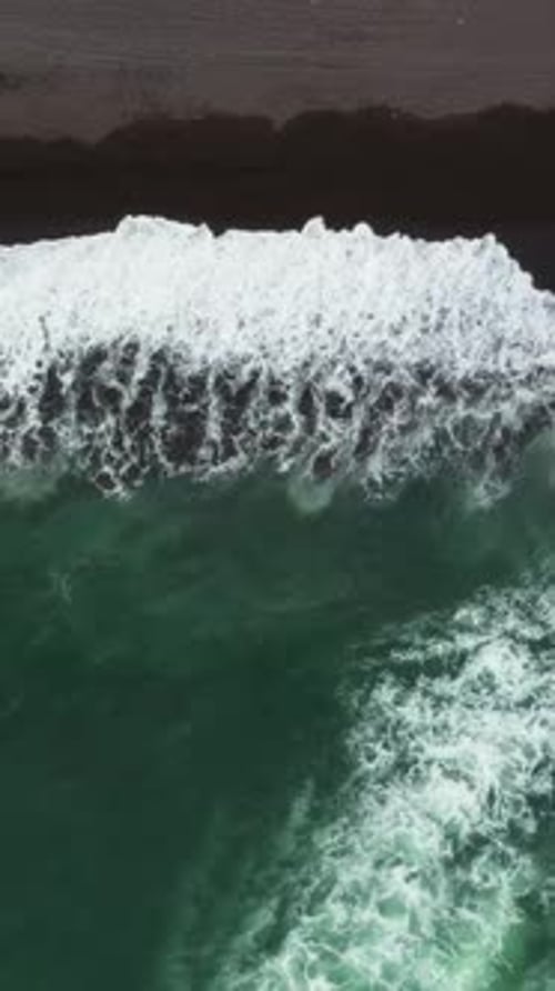 Aerial Top View of Beach with Black Sand