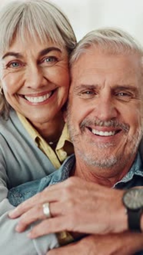 Smiling Senior Couple Embrace in Close Up Portrait