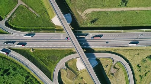 Transport Interchange on the Highway Aerial of Cars Drive Along the Highway Outside the City