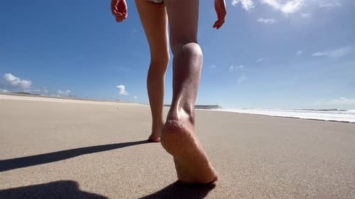 Children's Legs and Feet Walk and Run Barefoot on the Atlantic Ocean Beach A Child Plays on the