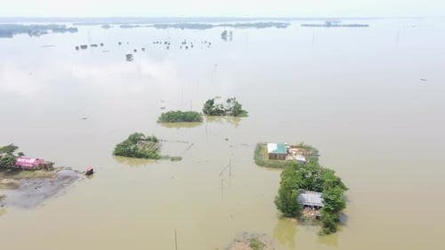 Flood water submerged entire rural village with houses and trees. Aerial view in Bangladesh, South