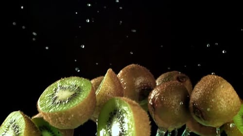 Fresh Kiwi Fruit Floating with Splashing Water