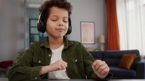Boy Listening to Music with Headphones and Phone
