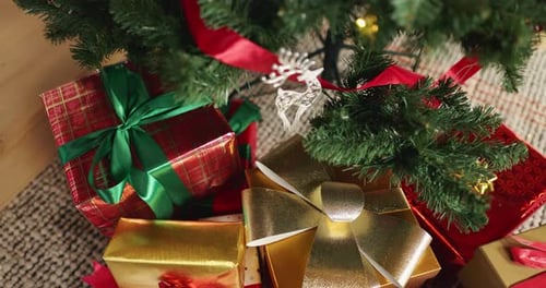 Christmas, tree or gifts with boxes on floor above for festive or december holiday celebration