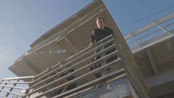 Parkour Artists Jumping off Railing of Construction Site, Sports Stock ...