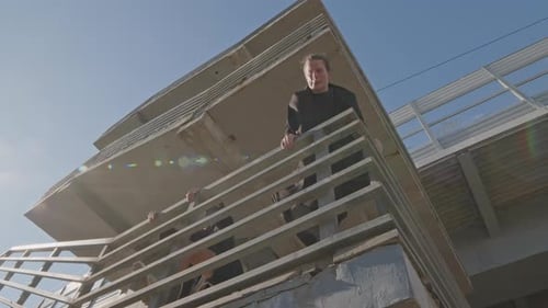 Young Adults Perform Parkour Moves in Urban Setting