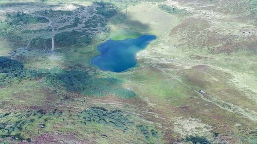 Serene Lake Reflects Majestic Mountain Landscape.
