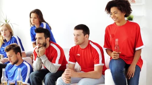 Friends watch sports, react to win and loss