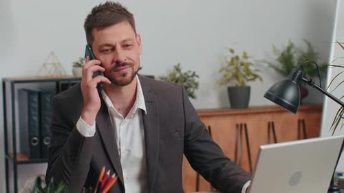 Business Man in Suit Working Having Mobile Phone Talk at Office Workplace Using Messenger Chat Apps