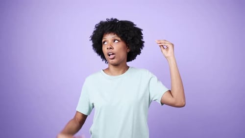Surprised Woman Gesturing, Talking on Purple Background