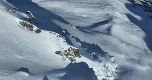 Snowy Mountains and Ski Village Aerial View