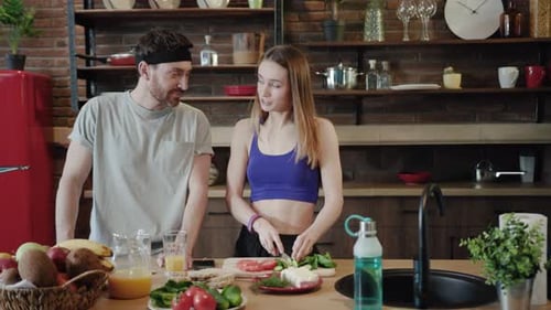 Couple Preparing Healthy Meal Together in Kitchen