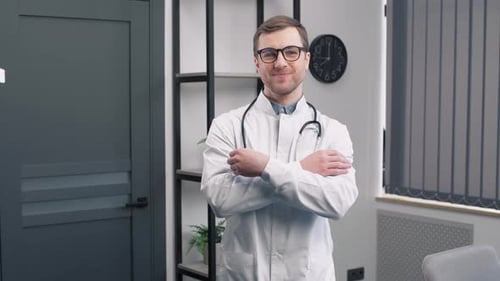 Smiling Young Doctor Poses Confidently in Office