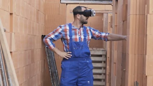 Construction Worker Using VR Headset at Building Site