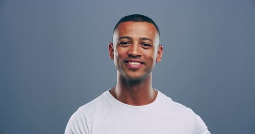 Smiling Man Forms Heart With Hands