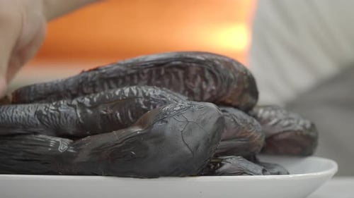 Grilled Black Eggplant Dish in Vibrant Kitchen