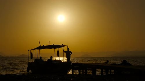 Silhouette Boat Ride on the Sea at Sunset