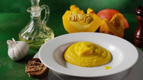 Creamy Pumpkin Soup Being Ladled in a Bowl