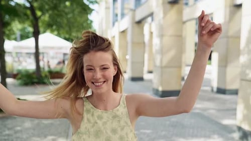 Young Happy Woman Jumping on Summer City Street in Slow Motion Feeling Excited