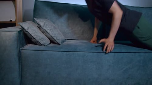 Young Man Lying Down on a Couch