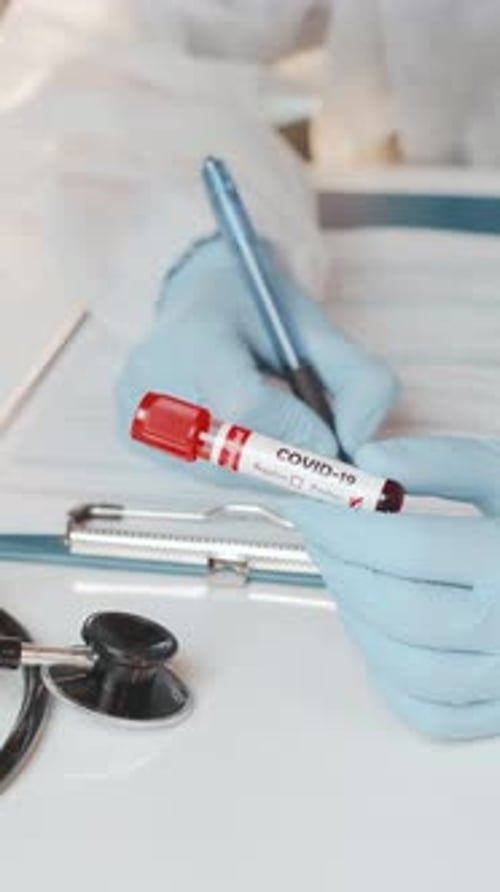 Doctor Records Covid-19 Test Results