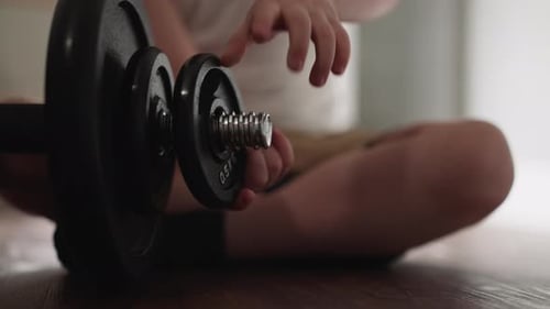 Curious Toddler Removes Gear Detail From Heavy Barbell