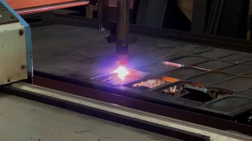 Running cutting laser plasma is making pattern on the iron plate
