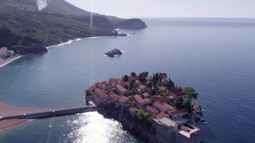 Aerial view of beach and resort on coast of Sveti Stefan, Montenegro.