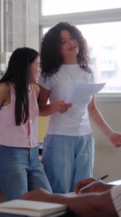 Two University Students Present a Project in Front of Their Classmates
