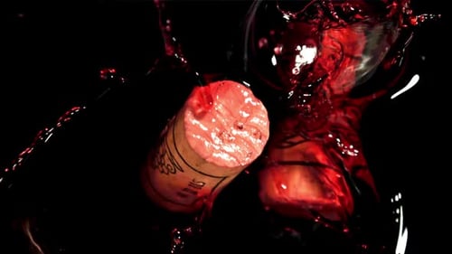 The Corks Fall Into the Red Wine Filmed on a Highspeed Camera at 1000 Fps