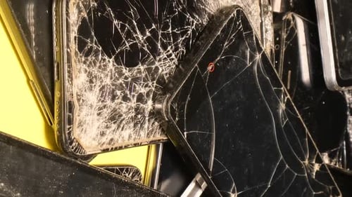 Old Smartphones at the Recycling Plant Faulty Broken and Outdated Equipment Vertical Video