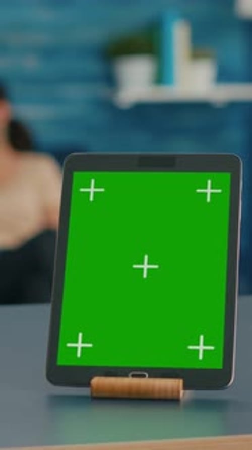 Tablet with Green Screen in Living Room