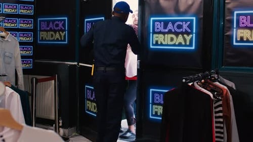 Crowd Rushing into Clothing Store on Black Friday