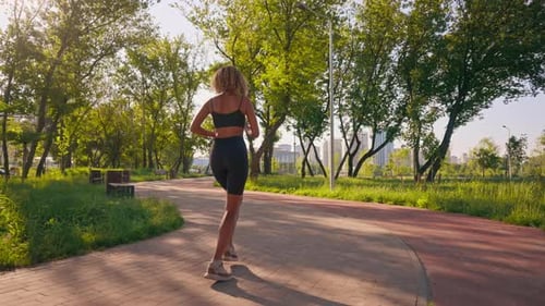 Female Jogger Cardio Training in Town