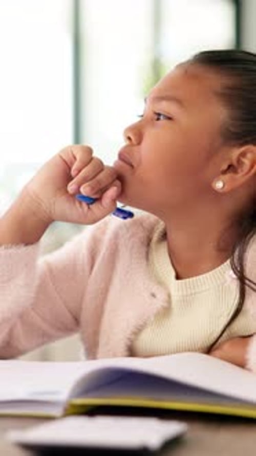 Study, thinking and kid with writing homework for math assessment, equation solution or growth