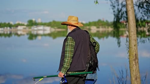 Grandfather and Grandson Fishing Together at the Lake