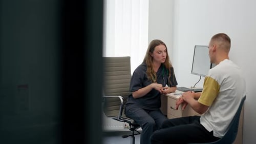 in a Modern Clinic in a Small Therapist s Office a Young Girl Doctor with a Stethoscope Conducts an