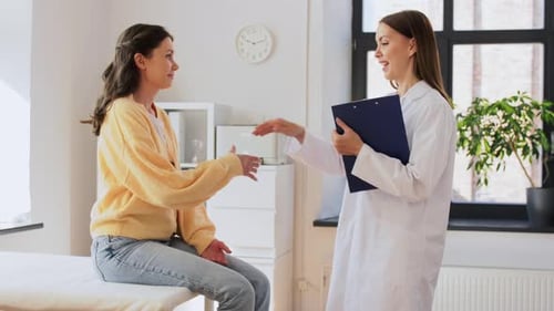 Woman consulting with her Doctor in Office