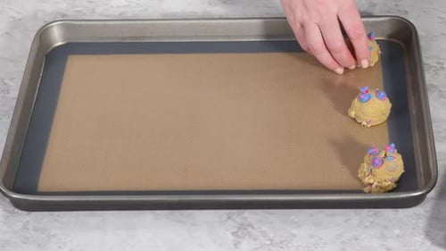 Chilled Cookie Dough Scoops on the Baking Sheet to Bake Unicorn Chocolate Chip Cookies