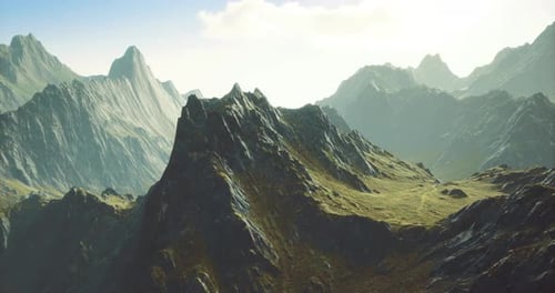 Majestic Mountain Landscape with Rugged Terrain and Sunlight in the Background