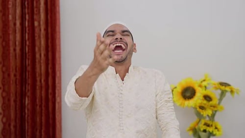 Muslim Man Laughing at Someone