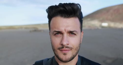 Closeup Shot Of Young Caucasian Man Looking Serious In Camera