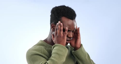 Anxiety, stress and man in studio with headache, vertigo or mistake, trauma